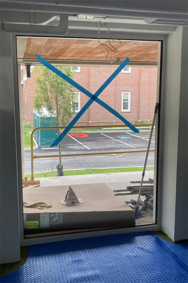 Floor-to-ceiling glass admits a lot of light into this new "huddle" meeting room in the Residence Life offices. A former Dining Services loading dock, just outside the glass, will be transformed into a patio. (Doug Hubley/Bates College)