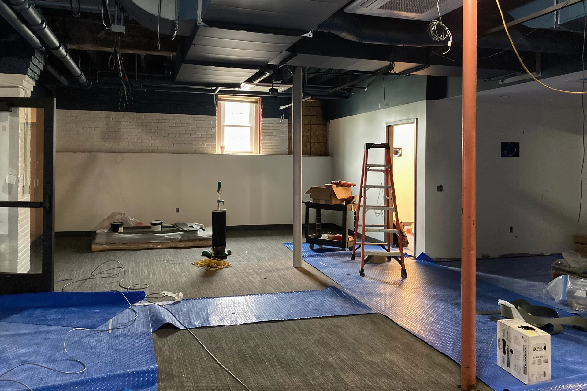 Once the location of student mailboxes and the entrance to the College Store, this ground-floor space in Chase Hall will soon be a student lounge. (Doug Hubley/Bates College)