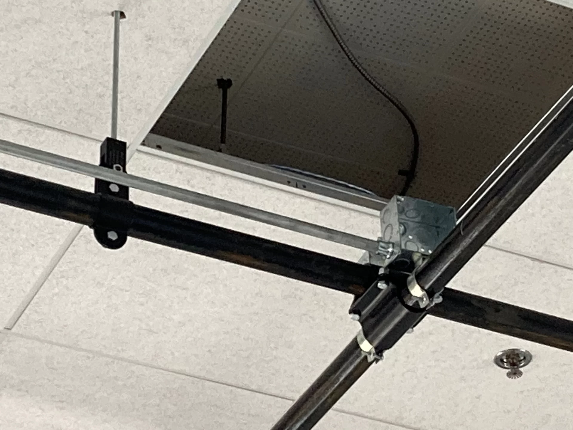 Here’s a close view of the ceiling grid that will be used to hang sound and imaging equipment for Bates’neew immersive media studio, in Coram Library. (Doug Hubley/Bates College)