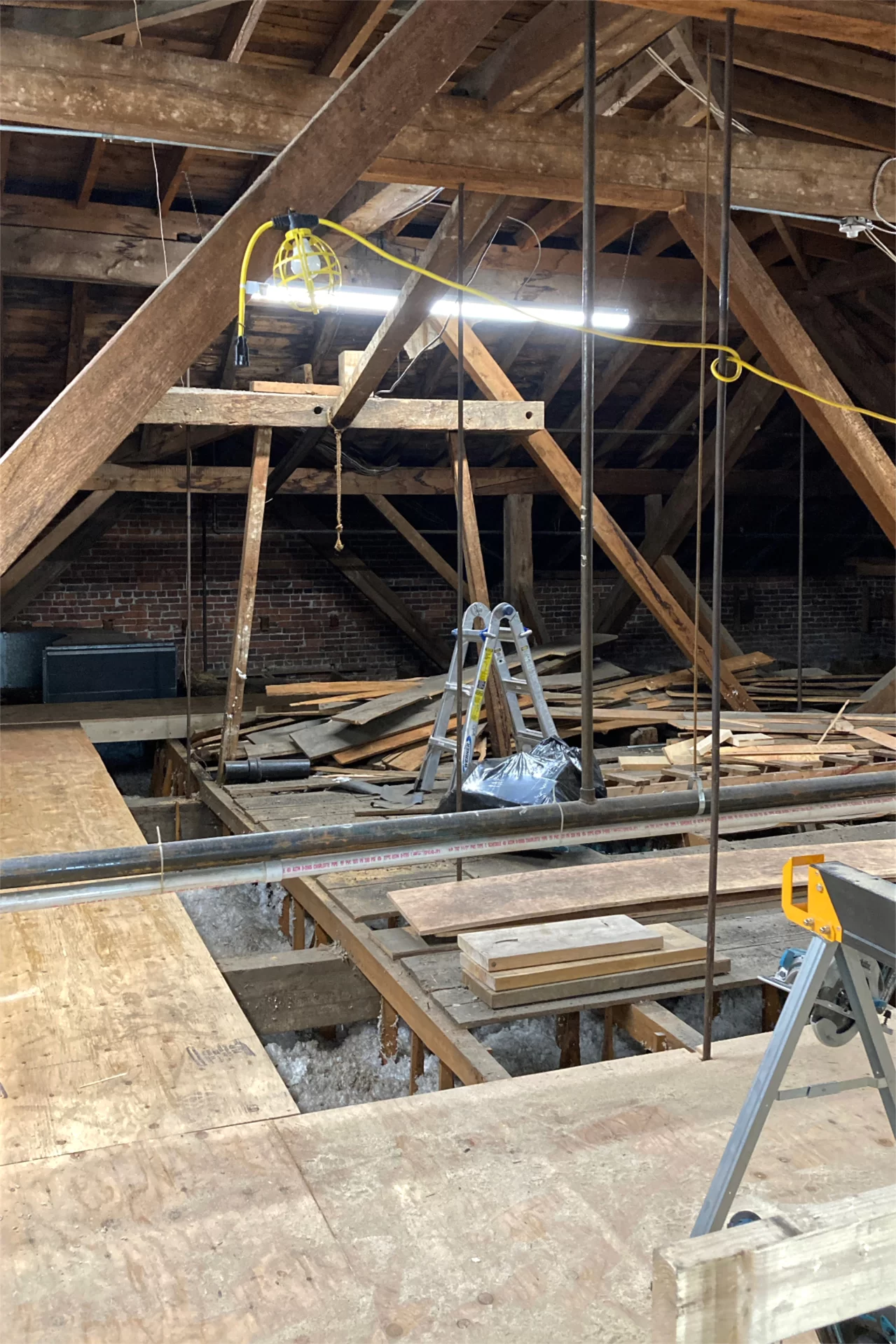 With new walkways and lighting in place, the attic of Hathorn Hall is a much safer and more agreeable place to work. New HVAC equipment will be installed there soon. (Doug Hubley/Bates College)