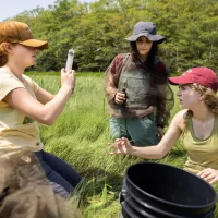 Professor of Earth and Climate Sciences Beverly Johnson takes her summer research students who are studying blue carbon cycling in salt marshes to Bates-MorseM ountain in Phippsburg.