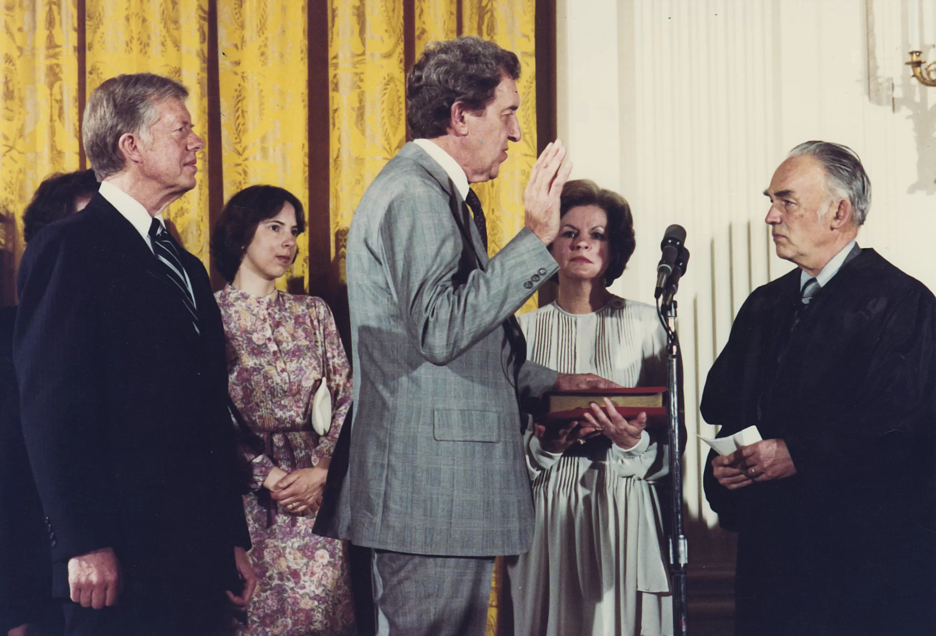 Edmund S. Muskie '36 is inaugurated as President Jimmy Carter's Secretary of State on May 8, 1980. From left: President Carter, Ellen Muskie Allen (daughter), Muskie, Jane Muskie (wife), Judge Frank Coffin, Bates Class of 1940. Photo by Fitzpatrick, Bill, The White House