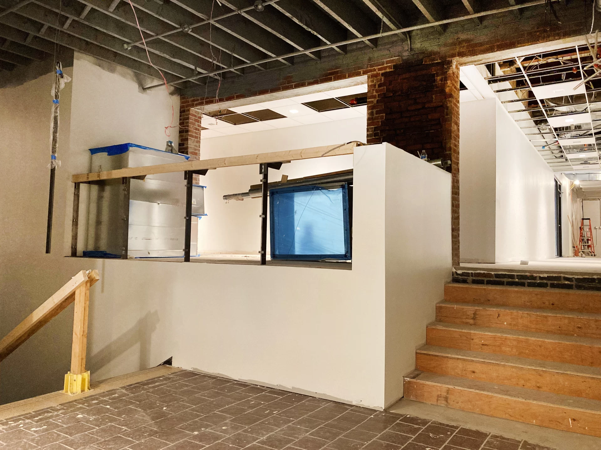 The "Overnook,” a distinctive seating area in Chase Hall’s first-floor lobby, looks spiffy with new wall board and paint on June 27. (Doug Hubley/Bates College)