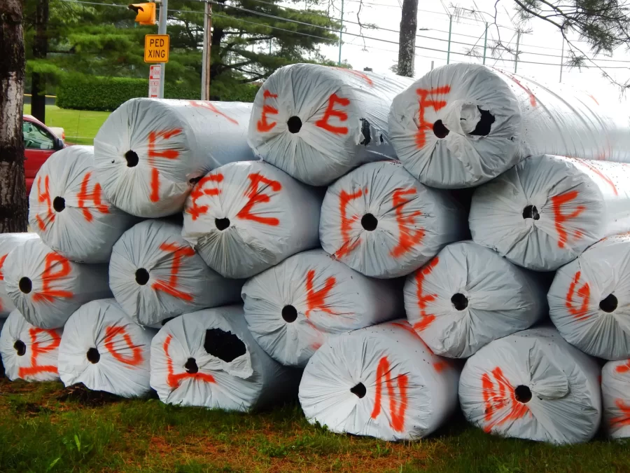 Shown near Central Avenue on June 27 are some of the 40 rolls of Shaw Sports Turf that will soon be placed on Garcelon Field. (Doug Hubley/Bates College)