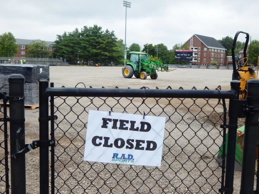 In this June 27 image, Garcelon Field has been stripped of its old playing surface and the placement of shock-absorbing panels on the bare ground is about to begin. (Doug Hubley/Bates College)