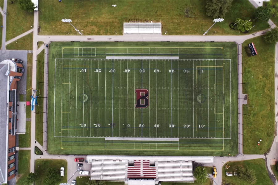 Before: Taken on June 14, this drone photo shows the 2010 Garcelon Field playing surface just prior to its removal. (Branden Rush/Bates College)
