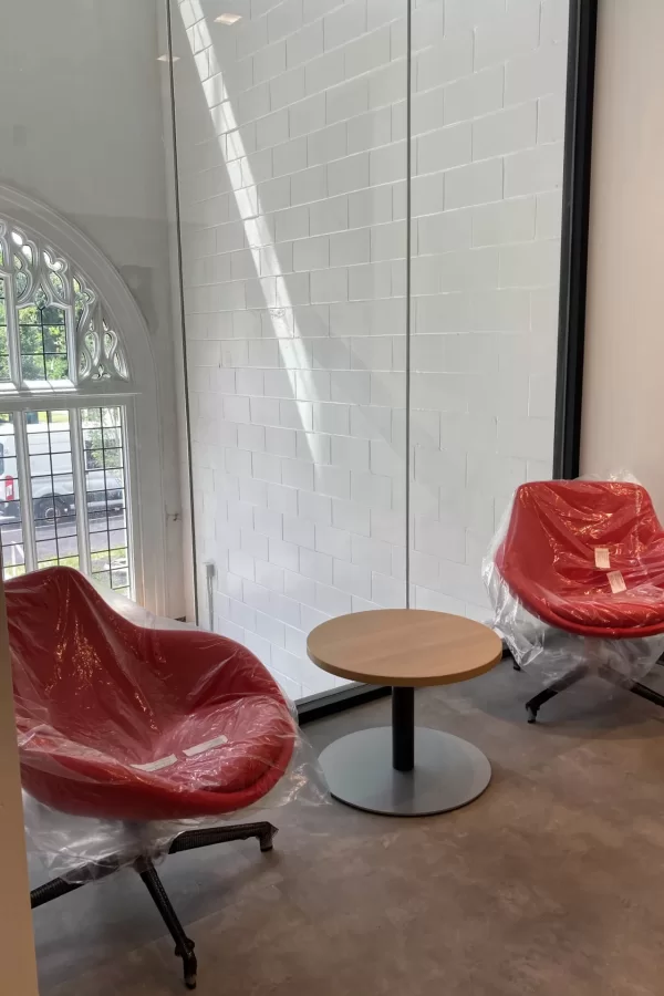 This seating area in the Center for Purposeful Work backs up to the so-called lightwell, a former stairwell that still encloses one of Chase Hall’s two Campus Avenue entrances. (Doug Hubley/Bates College)