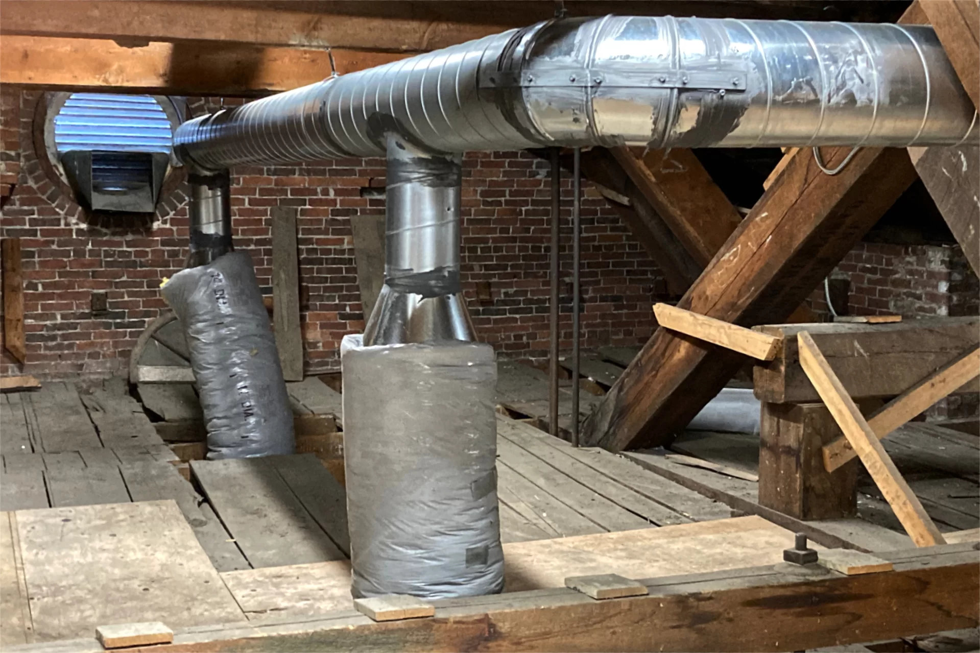 New ventilation ducts in the attic of Hathorn Hall. (Doug Hubley/Bates College)