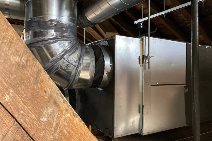 The installation of this new air handler was a key goal of the summer’s refurbishment of the attic of Hathorn Hall. (Doug Hubley/Bates College)