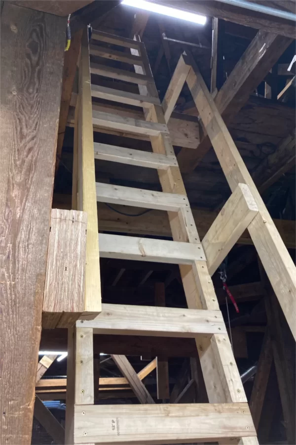 Carpenters for MW Hoss of Portland, Maine, built this new ladder leading up to the Hathorn Hall belfry. (Doug Hubley/Bates College)