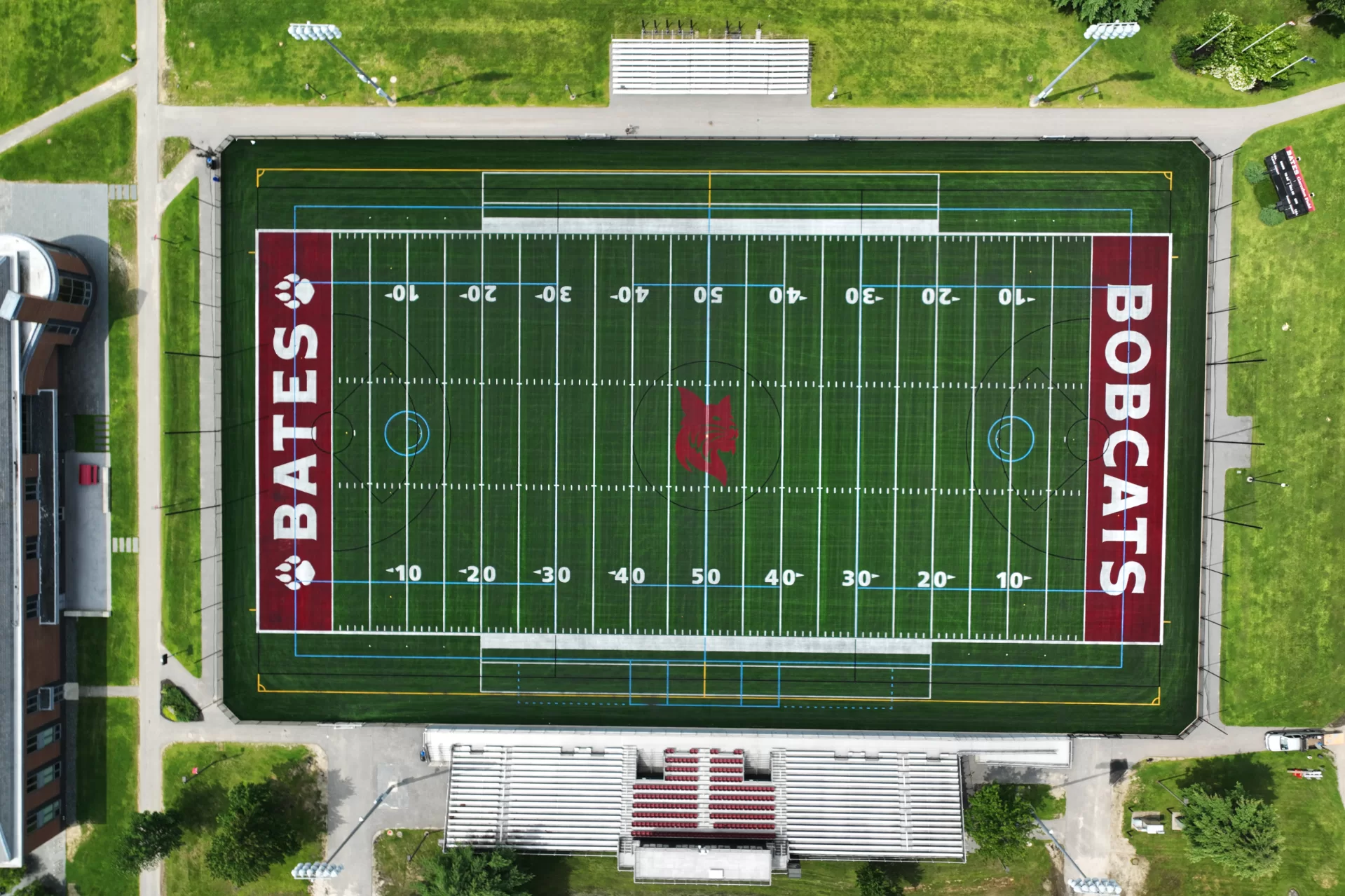 And after: Here's an aerial view of the brand-new Garcelon Field turf, taken on Aug. 3. Commons is shown at left. (Branden Rush/Bates College)