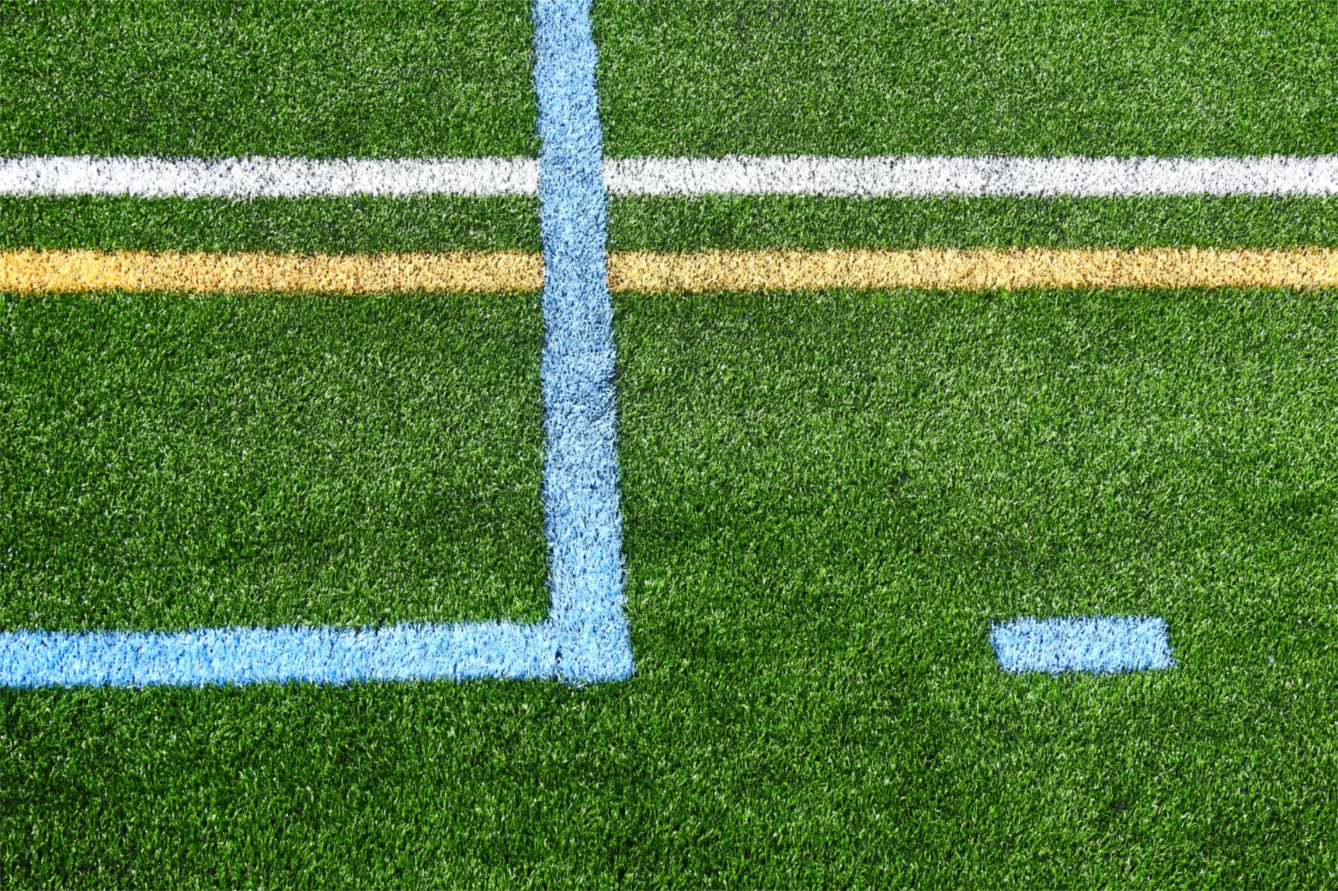 As Garcelon Field is a multi-sport facility, different colors indicate markings on the turf for different games. Most of these field graphics were sewn in by hand. (Jay Burns/Bates College)