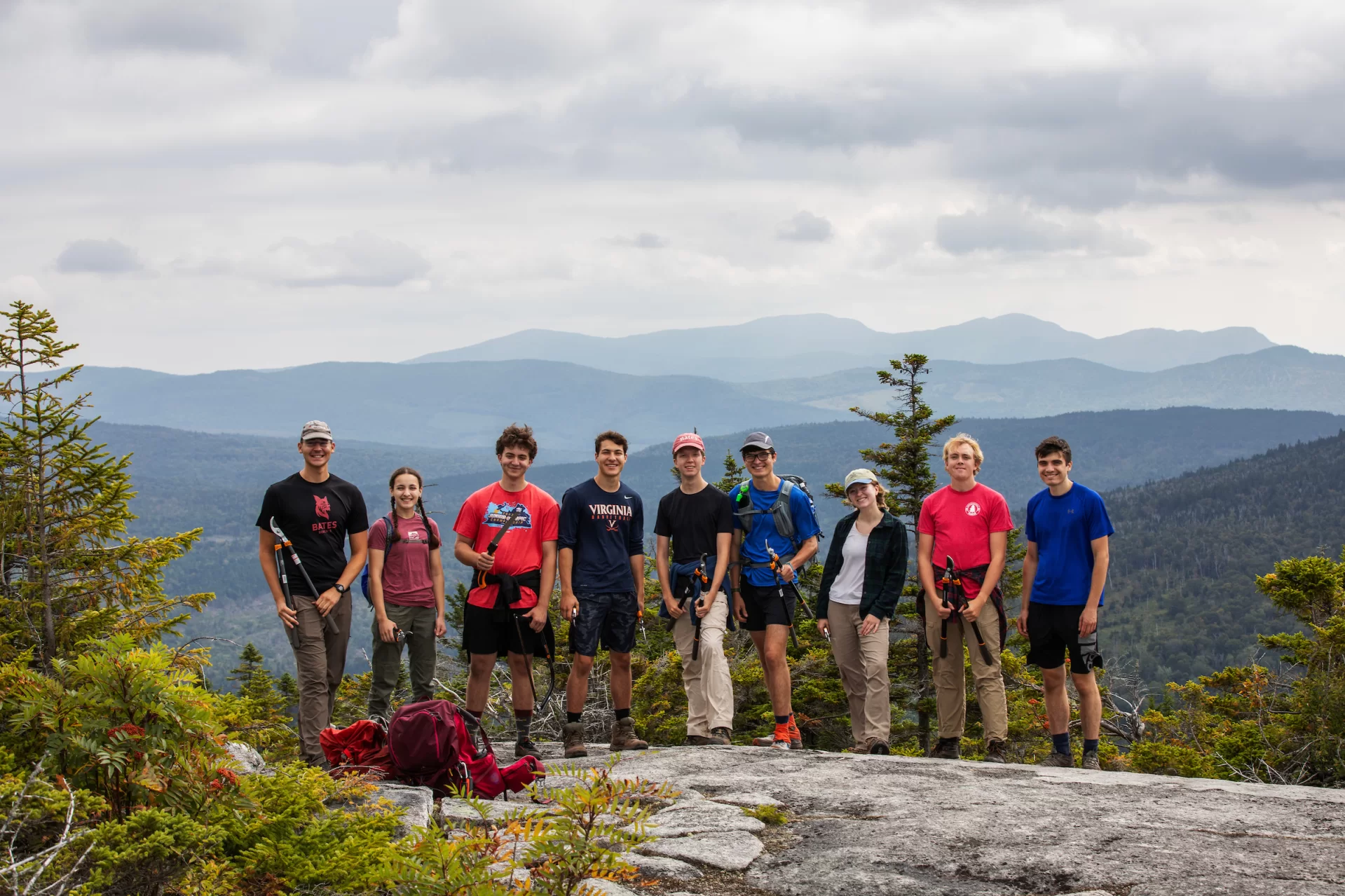 Students from the Appalachian Trail Maintenance AESOP trip pose for a portrait after breaking for lunch on top the Bemis Mountain Second Peak on September 3rd, 2023.

(Theophil Syslo | Bates College)