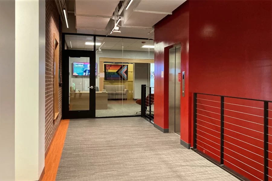 Taken on the top level of Chase Hall’s Central Stair, this view includes the new reception area for the Office of Intercultural Education. Each of the Central Stair’s four levels has a different accent color in the carpet as an aid to wayfinding. (Doug Hubley/Bates College)