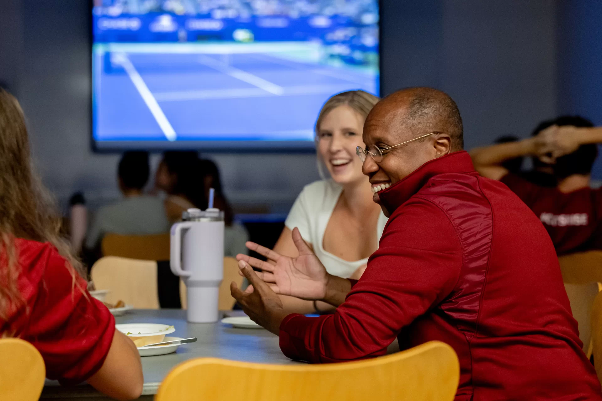 Men’s and Women’s Tennis teams with Coach Paul Gastonguay have a U.S. Open Watch Party, attended by President Garry W. Jenkins who is a tennis player, and faculty tennis liaison Aleks Diamond-Stanic,