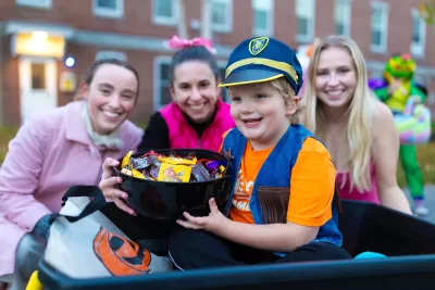 Last night was a sweet treat. The kids had an absolute blast and we think the trick-or-treaters had fun too. Thanks to the @batesharward Center, the City of Lewiston (@officiallewistonme), and The American Red Cross for helping us host such a special event for our community. We could see on our students' faces how healing it was to help bring some joy to our beloved city and home. President Garry W. Jenkins and his husband Jon Lee also joined in on the fun helping Bates students hand out the many pieces of candy made available at the event. We also want to thank all the families for coming out and sharing your Halloween with us.