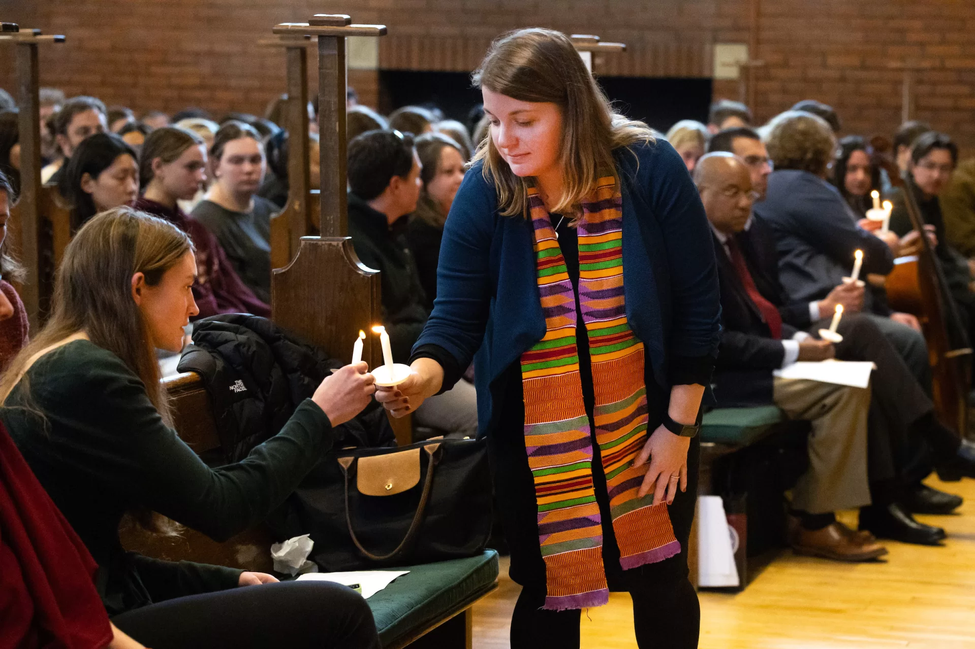 “The brightness that shines through the dark of a tragedy such as we have suffered here in Lewiston, our home, is what it always is in times like these: the immense capacity of our shared humanity,” said Bates President Garry W. Jenkins in his remarks during today’s Vigil for Grief and Remembrance, held at 4:30 p.m. in Gomes Chapel on the one-week anniversary of the shootings in Lewiston.

Led by the Rev. Brittany Longsdorf, the college’s multifaith chaplain, the vigil gave the campus community an opportunity to come together for silence, candle lighting, poetry, and interfaith prayers, and, ultimately, to share communal grief with their Lewiston community.
Welcome & Naming Grief: Brittany Longsdorf, 
Multifaith Chaplain and Visiting Lecturer in the Humanities

Bates President Garry W. Jenkins Remarks

Lewiston Mayor Carl Sheline’s Remarks 

Invitation for Sharing: Brittany Longsdorf

*Barry Music* (single floor mic, guitar output)

Reading of the Names: Brittany Longsdorf and Raymond Clothier, associate multifaith chaplain
•	Tricia C. Asselin
•	Peyton Brewer-Ross
•	William Frank Brackett
•	Thomas Ryan Conrad
•	Michael R. Deslauriers II
•	Maxx A. Hathaway
•	Bryan M. MacFarlane
•	Keith D. Macneir
•	Ronald G. Morin
•	Joshua A. Seal
•	Arthur Fred Strout
•	Stephen M. Vozzella
•	Lucille M. Violette
•	Robert E. Violette
•	Joseph Lawrence Walker
•	Jason Adam Walker
•	William A. Young
•	Aaron Young
*moment  of silence* & closing, begin to pass candle lighting 

READINGS (all from Lectern mic unless noted)
Aneeza Ahmad ‘25 of Sharon, Mass., and Alaina Rauf ‘25 of Yarmouth, Me., of the Bates Muslim Student Association 
Sophie Leight ‘26 of Easton, Md.
Venerable Tenzin Dasel, ‘88 - volunteer spiritual advisor and founder of the Maine Mindfulness Project and is an active retreat leader and speaker in the International Network of Engaged Buddhists 
Levi Mindlin ‘24 of Portland, Ore - song (single floor mic, guitar output)