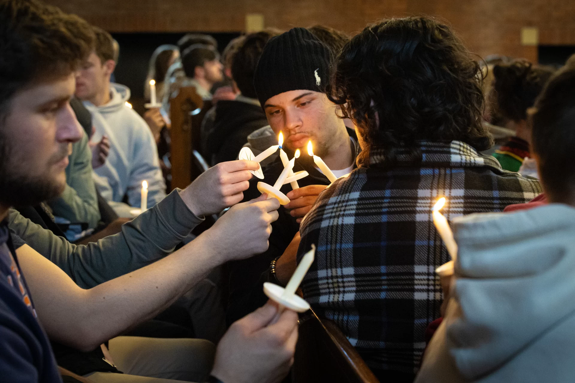 “The brightness that shines through the dark of a tragedy such as we have suffered here in Lewiston, our home, is what it always is in times like these: the immense capacity of our shared humanity,” said Bates President Garry W. Jenkins in his remarks during today’s Vigil for Grief and Remembrance, held at 4:30 p.m. in Gomes Chapel on the one-week anniversary of the shootings in Lewiston. Led by the Rev. Brittany Longsdorf, the college’s multifaith chaplain, the vigil gave the campus community an opportunity to come together for silence, candle lighting, poetry, and interfaith prayers, and, ultimately, to share communal grief with their Lewiston community. Welcome & Naming Grief: Brittany Longsdorf, Multifaith Chaplain and Visiting Lecturer in the Humanities Bates President Garry W. Jenkins Remarks Lewiston Mayor Carl Sheline’s Remarks Invitation for Sharing: Brittany Longsdorf *Barry Music* (single floor mic, guitar output) Reading of the Names: Brittany Longsdorf and Raymond Clothier, associate multifaith chaplain •Tricia C. Asselin •Peyton Brewer-Ross •William Frank Brackett •Thomas Ryan Conrad •Michael R. Deslauriers II •Maxx A. Hathaway •Bryan M. MacFarlane •Keith D. Macneir •Ronald G. Morin •Joshua A. Seal •Arthur Fred Strout •Stephen M. Vozzella •Lucille M. Violette •Robert E. Violette •Joseph Lawrence Walker •Jason Adam Walker •William A. Young •Aaron Young *moment of silence* & closing, begin to pass candle lighting READINGS (all from Lectern mic unless noted) Aneeza Ahmad ‘25 of Sharon, Mass., and Alaina Rauf ‘25 of Yarmouth, Me., of the Bates Muslim Student Association Sophie Leight ‘26 of Easton, Md. Venerable Tenzin Dasel, ‘88 - volunteer spiritual advisor and founder of the Maine Mindfulness Project and is an active retreat leader and speaker in the International Network of Engaged Buddhists Levi Mindlin ‘24 of Portland, Ore - song (single floor mic, guitar output) Ethan Baker ‘24