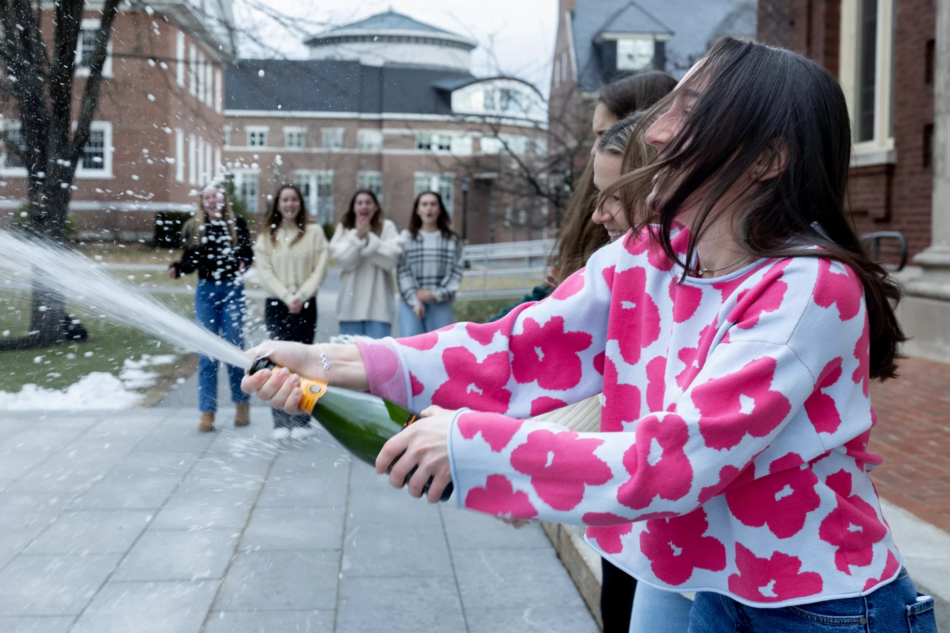 “It’s really exciting!” — Ella Blum ’24 of South Salem, N.Y.. Among the many seniors, who during the last seven days participated in the joyful Bates ritual of senior thesis binding, biology major Hahn, then Blum and her women’s field hockey teammates Molly Griffin ’24 of Holden, Mass., and Molly Harmon ’24 of Farmington, Maine, gathered before their respective groups of friends in front of Coram Library to bind their senior theses and launch a celebration. Blum produced a sociology thesis: “The Narratives of Fandom: Sports Identity Development and Retention Among College-Aged Students.” Griffin wrote a thesis in psychology: “Do Logos with Incongruent Color Backgrounds Slow Down People’s Reaction Times to the Color? Is This Effect Larger for Preferred Logos?’” Harmon produced a thesis in earth and climate sciences: “Determining Surface Rupture of the 1803 Earthquake in Central Himalaya Using Paleoseismology.” Congratulations to everybody!