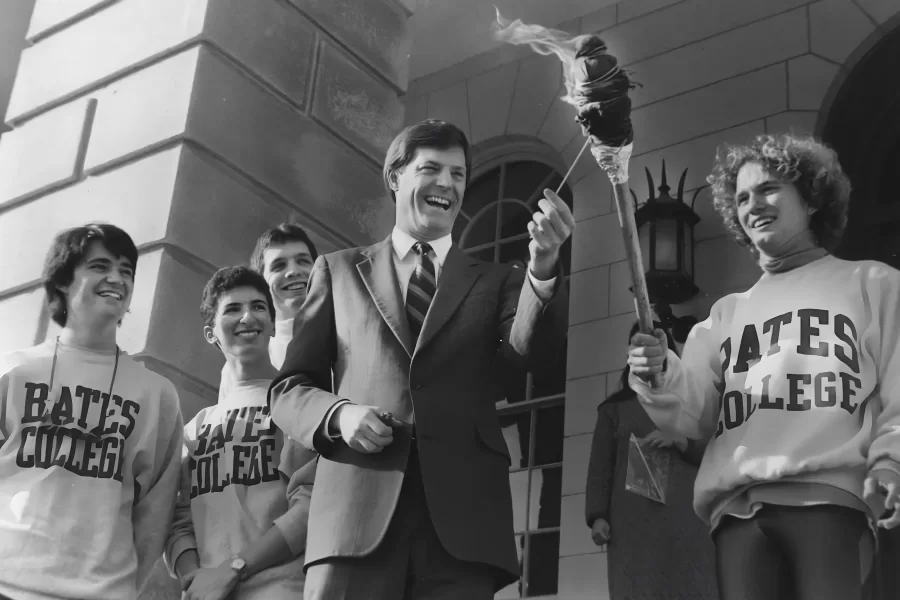 Maine Gov. John McKernan lights the torch for the 1989 Winter Carnival.