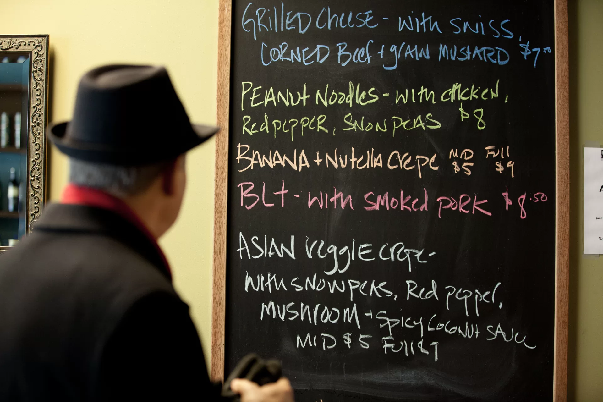 - A patron reviews the specials menu board at Lewiston's Lisbon Street restaurant Marché.