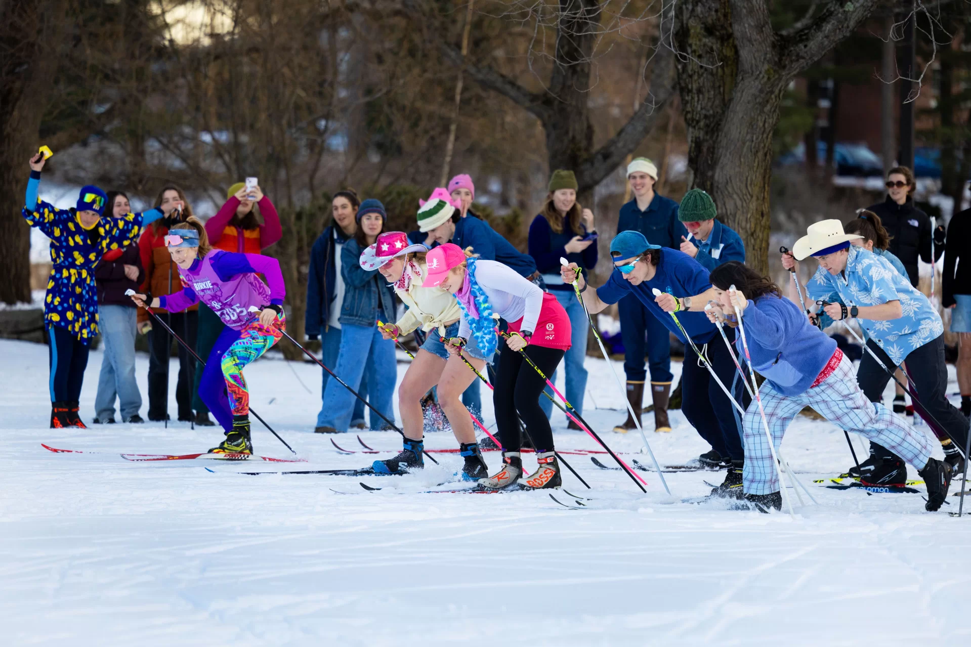 It was all about the teamwork. And the costumes.

Students who participated in the Nordic Ski Relay yesterday, Feb. 7, at Paige Field were asked to arrive with friends to create teams of four for “THE BEST SKI EVENT” of the 2024 Bates Winter Carnival.

Two pairs of skis per relay team were required. Skiers could bring their own gear or investigate the college’s Eroom to borrow. “Other forms of free-heeled skis are acceptable if you must,” the co-sponsors @batesnordic and @batesoutingclub noted.

“Picture this: you, glitter, flair, stoke, snow, falling, (healthy?) competition, a skinny ski relay. You thought Lost Valley takeover was unbeatable, you thought wrong.”
