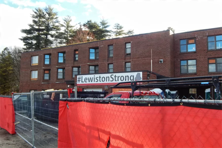 This view shows the northern end of 96 Campus Avenue, including the loading area that will be reconfigured into a new main entrance, at center. The "#LewistonStrong” banner was hung in a gesture of moral support after the shootings in Lewiston last October. (Doug Hubley/Bates College)