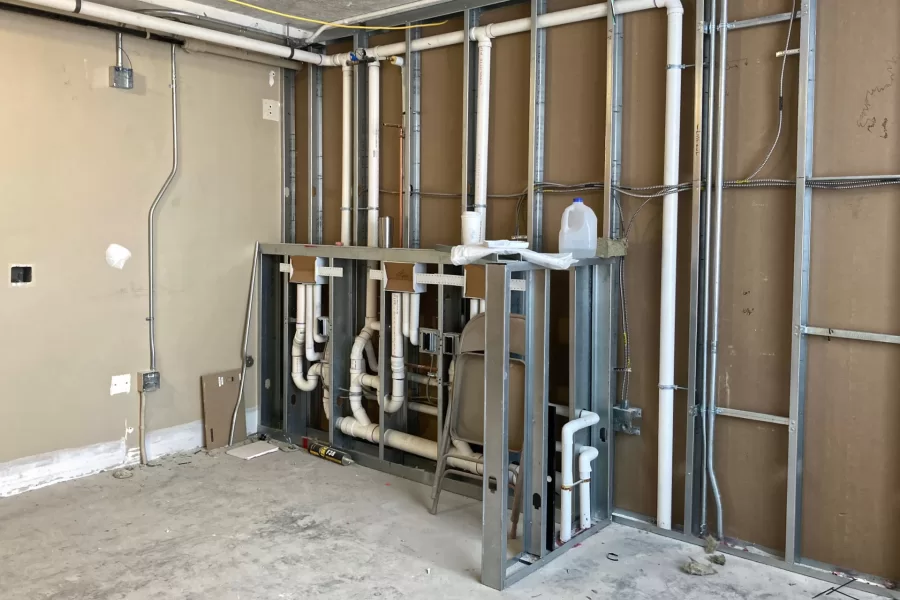 In-wall utilities are all but complete in the student laundry room at 96 Campus Ave. (Doug Hubley/Bates College)