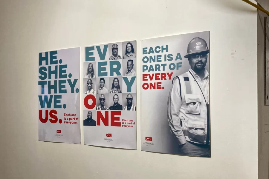 Posted on the first floor of 96 Campus Ave., these posters encourage solidarity among Consigli Construction employees. The firm is managing the building’s renovation for Bates. (Doug Hubley/Bates College)