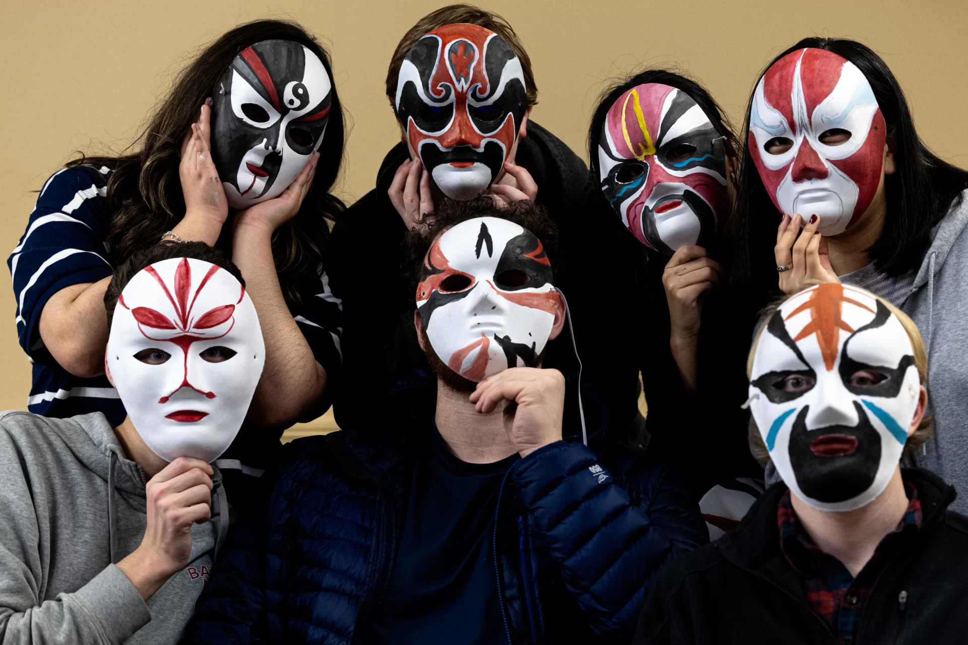 Provided with blank masks and prepared Chinese watercolor paints and brushes, six Chinese language students, led by Learning Associate in Chinese Veronica Huang, recently gathered around a Roger Williams Hall table to create the traditional faces of Peking Opera masks.

The students were able to use pictures of Peking Opera masks provided by Huang as a reference. Or they could design their own.

According to Huang, “Different face colors represent different characters and personalities.” For instance, the color red on a mask represents the character wearing it as “brave and loyal.”

Huang worked alongside the students to make the masks in other colors too. “By making these Peking Opera masks, students can experience traditional Chinese Opera culture more vividly,” she says, “which will have a positive impact on their learning of Chinese language and culture.”

Sheila Robledo ‘25, Alex Sandvil ‘27, Alex Takeyh ‘26, Cora Zuwallack ‘27, Myat Htut ‘27, and Vova Sosnovskii ‘26 wound down a busy week with the creative activity. Huang plans to decorate the Chinese department’s hallway with their efforts.