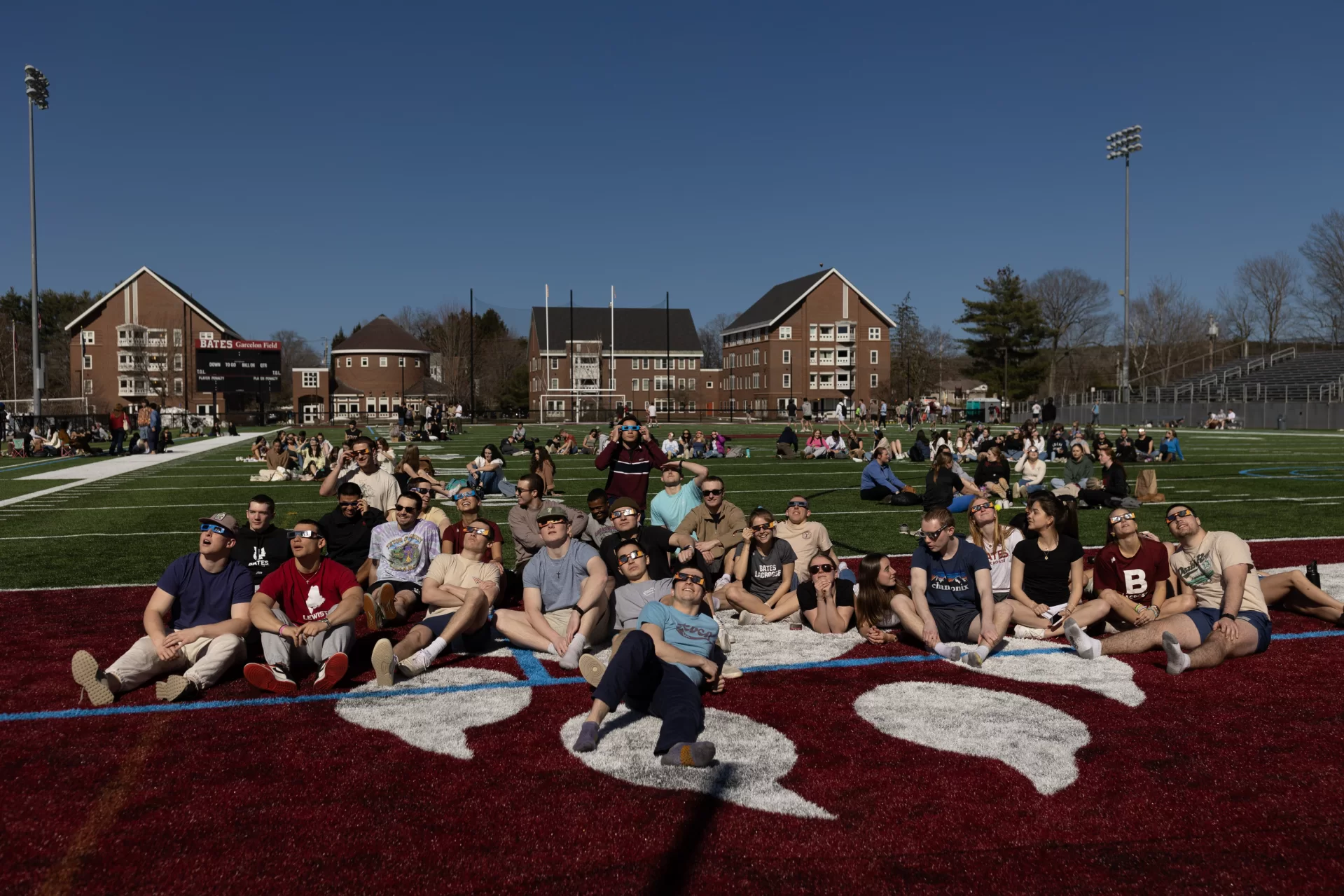 Members of the Bates community gathered around campus this afternoon for the April 8, 2024 solar eclipse as the moon obscured the sun, beginning at 2:20 p.m. and reaching maximum coverage of 96.5% at 3:31 p.m.

Faculty, staff, students, and families with newly admitted students participating in today’s Admission program, Bates Beginnings (and what a way to kick off your Bates experience), observed in awe and delight as the phenomenon played out.

Skies darkened, smiles brightened, and temperatures (noticeably!) dropped. New memories were made.

Unforgettable. Swipe left. You won’t see the eclipse. But you will see those who watched it.
