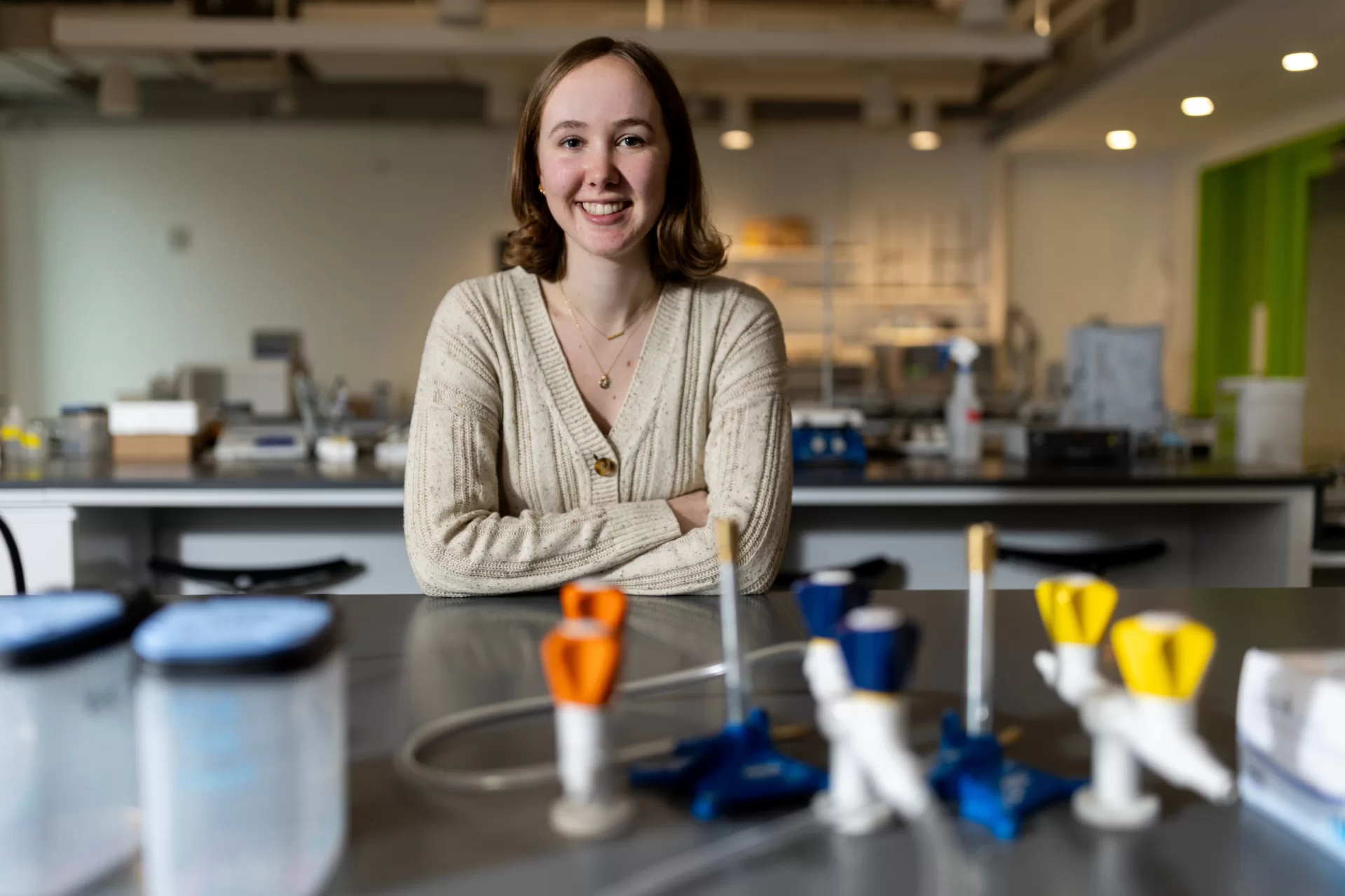 Emily Scarrow’25 of Washington, DC poses in the Bonney Science Center’s biochemistry lab for a story about her being named as a 2024winner of the Barry Goldwater Scholarship.