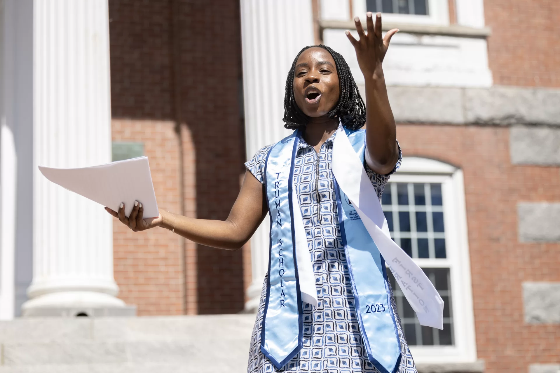 Two close friends who met on their first day at Bates chose to bind their senior theses together on the steps of Hathorn Hall on April 17, 2024.

In the company of friends, staff, and faculty, Aaliyah Moore ’24 and Prinnes Wilson’24 paid tribute to each other, to those gathered, and to family members who have supported them along the way.

Wilson, a psychology major from Las Vegas, wrote a thesis titled “The Relationship Between Aging and Proximity to Clothing,” under the supervision of Visiting Assistant Professor of Psychology Katherine Mathis. After the binding, Wilson expressed pride in his thesis. “It’s a good representation of me,” he said.

Moore, a double major in Africana and politics from Phoenix, Ariz., bound two theses. Her honors thesis in Africana, written under the supervision of Professor of English Therí Pickens, is titled: “Alice Walker’s ‘The Color Purple’: An Authentic Depiction of Confinement in Historical Fiction.” Moore called Pickens her “spiritual guide” whose “unwavering support, grace, and kindness know no bounds.”

Moore’s politics thesis, written under the supervision of Professor of Politics Stephen Engel, is titled “Rethinking the Supreme Court’s Approach to Discrimination Cases: Adopting a Comprehensive Framework.”