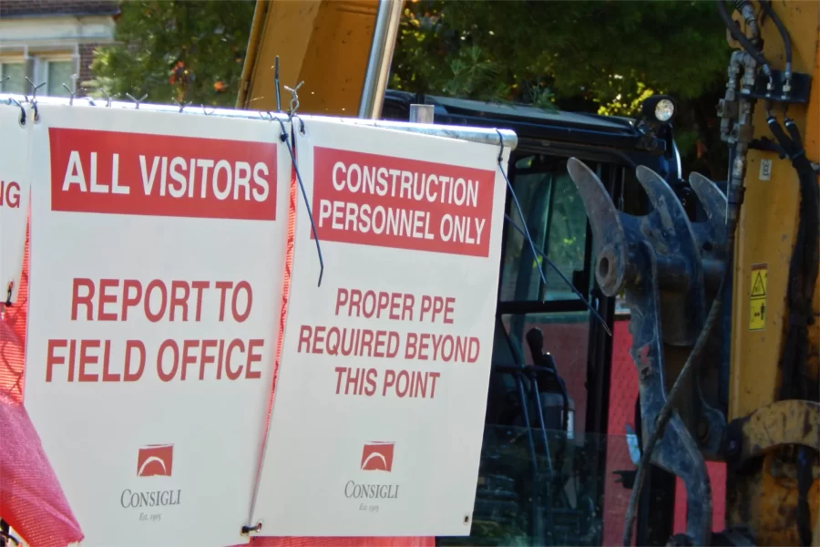 Consigli communications and the business end of an excavator at 96 Campus Avenue, seen from the street. (Doug Hubley/Bates College)