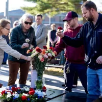 On Veterans Day, we pause to reflect and remember. During this morning’s gathering at Bates Veterans Plaza, Joe Castonguay of Facility Services lays a flower atop one of the basalt stones that comprise the plaza centerpiece. “I learned the value of human life in combat,” said Castonguay, a U.S. Army veteran who served for 15 months in Iraq. The Rev. Dr. Brittany Longsdorf, @bates_multifaith chaplain, guided today’s centering moment, which included reflective readings and interfaith prayers, the observing of silence, and the ritual of laying flowers to honor the service and sacrifice of veterans. Dedicated in 2020 and located near the Benjamin E. Mays Center, the plaza honors Bates veterans and invites “reflection on the impact of war on the lives of everyone it touches.” President Garry W. Jenkins was in attendance.