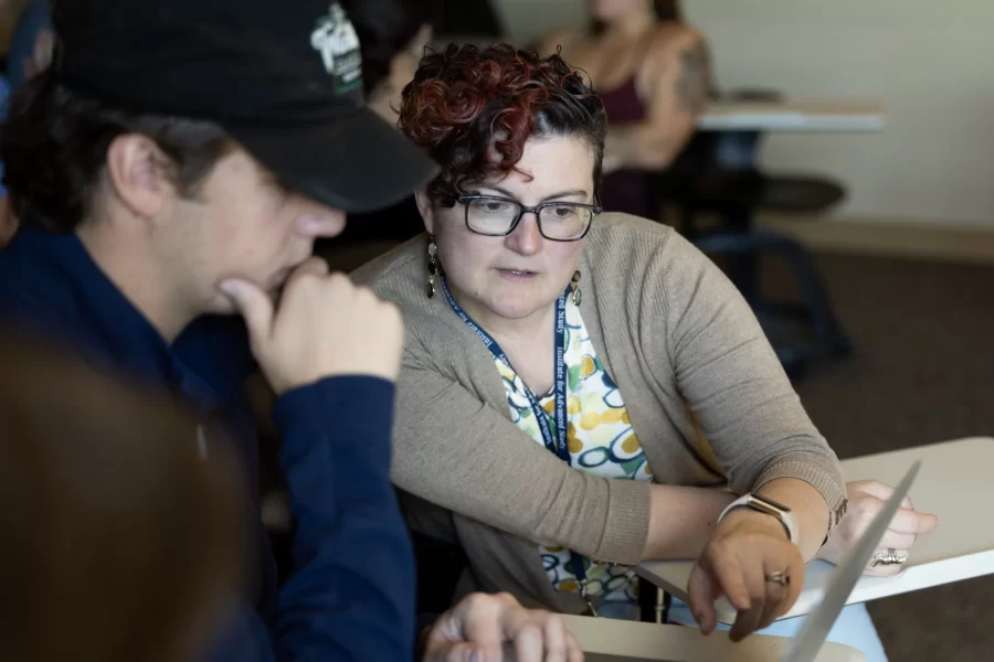 Associate Professor of Digital and Computational Studies Carrie Diaz Eaton teaches MATH 316 - PIC Math: Community Engaged Data Science in Roger Williams 413 on Oct. 4, 2023.
This PIC Math (Preparation for Industrial Careers in Mathematical Sciences) course is intended for students with a strong interest in industrial applications of mathematics and computation. Students work in teams on a research problem identified by a community partner from business, industry, or government. Students develop their mathematical and programming skills as well as skills and traits valued by employers of STEM professionals, such as teamwork, effective communication, independent thinking, problem solving, and final products. Prerequisite(s): MATH 205 and 206.
In an adjacent RW lounge, a group meets with its DCS community partner Jacqueline Crucet, Neighborhood Development Planner, on Zoom to discuss insights into housing data for the City of Lewiston.
In frame #690. From left, Jacob Gordon ’24, Cameron Frary ’24, Spencer Obiero ’25, and Elvira Keira Ishimwe ’25.
