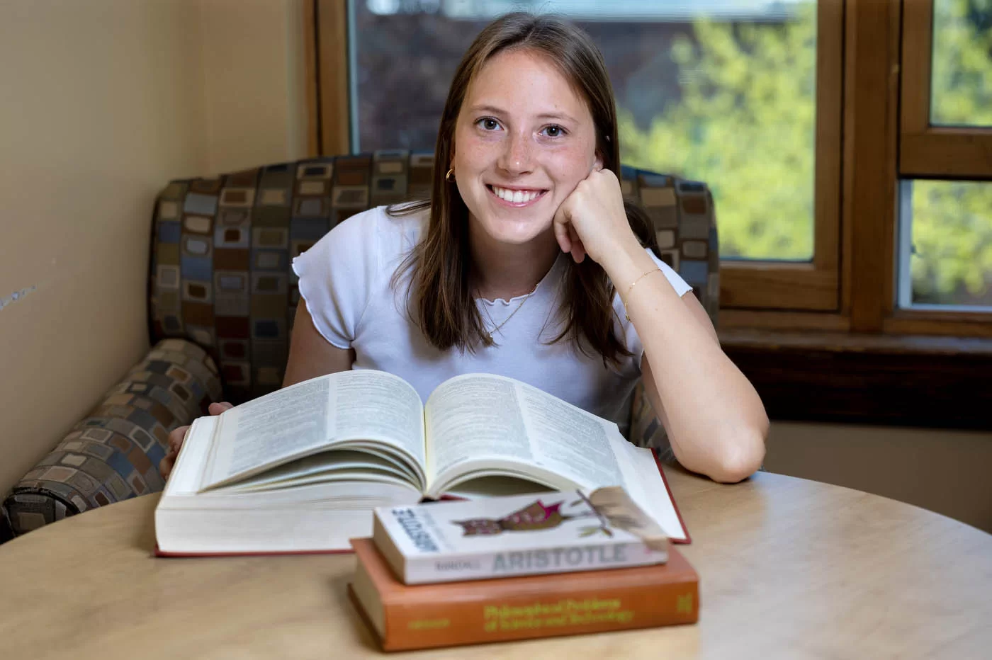 person positing with an open book