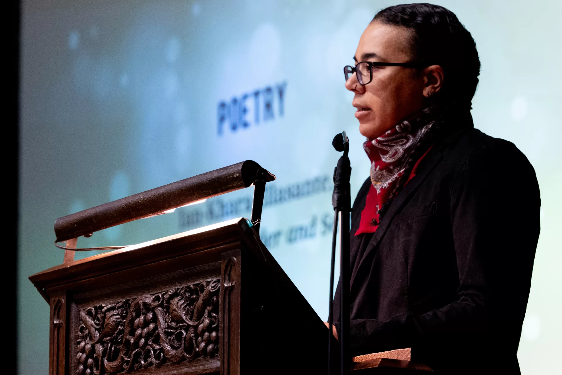person at lectern
