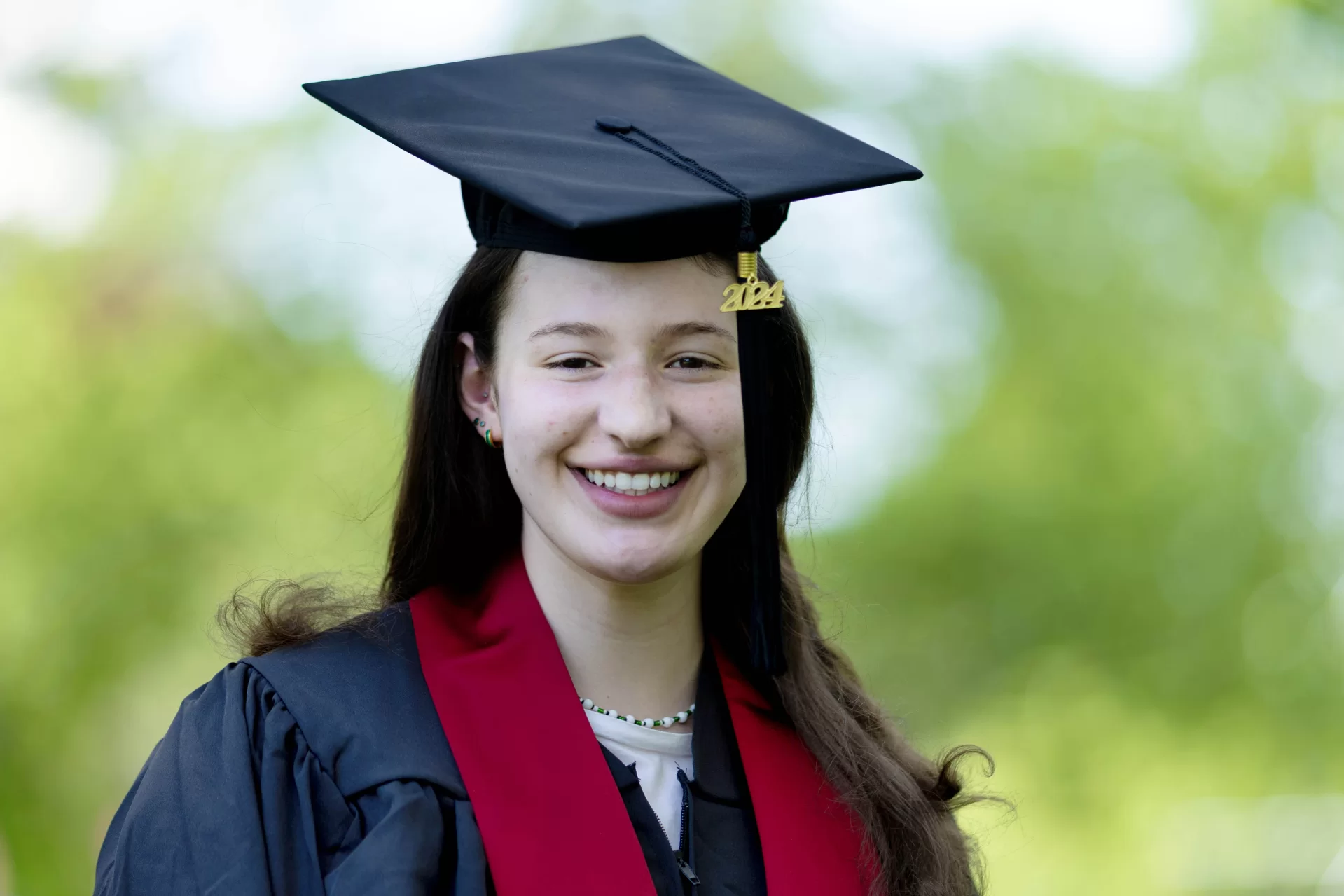 person posing in graduation regalia