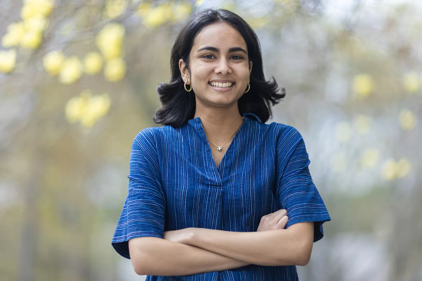 person posing with arms folded