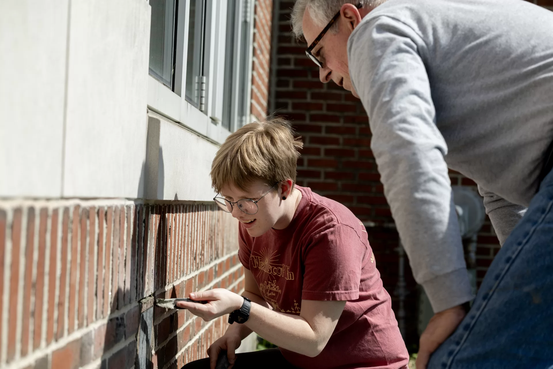 student works on masonry project