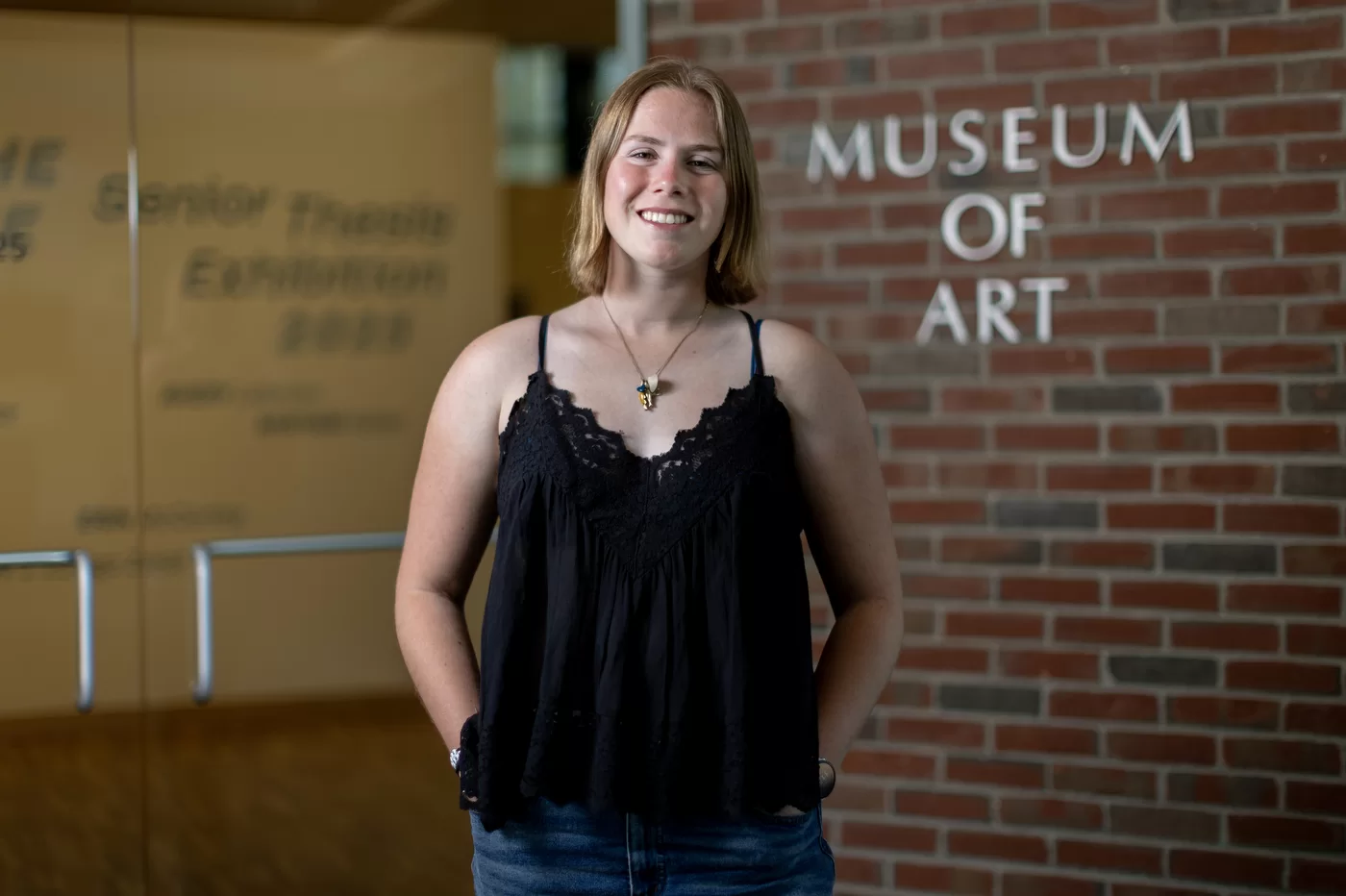person standing in front of a museum entrance