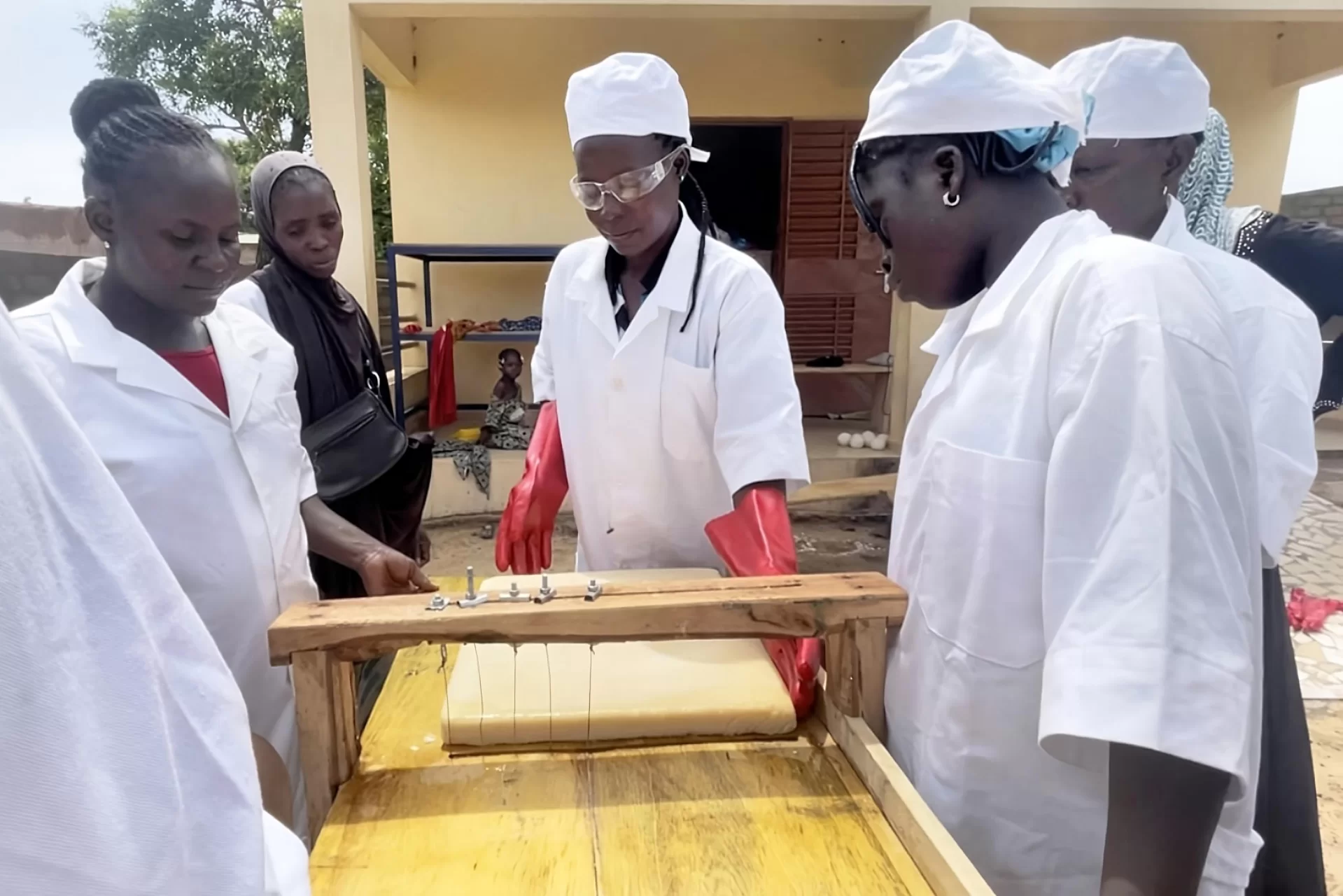 group of woman working soap making