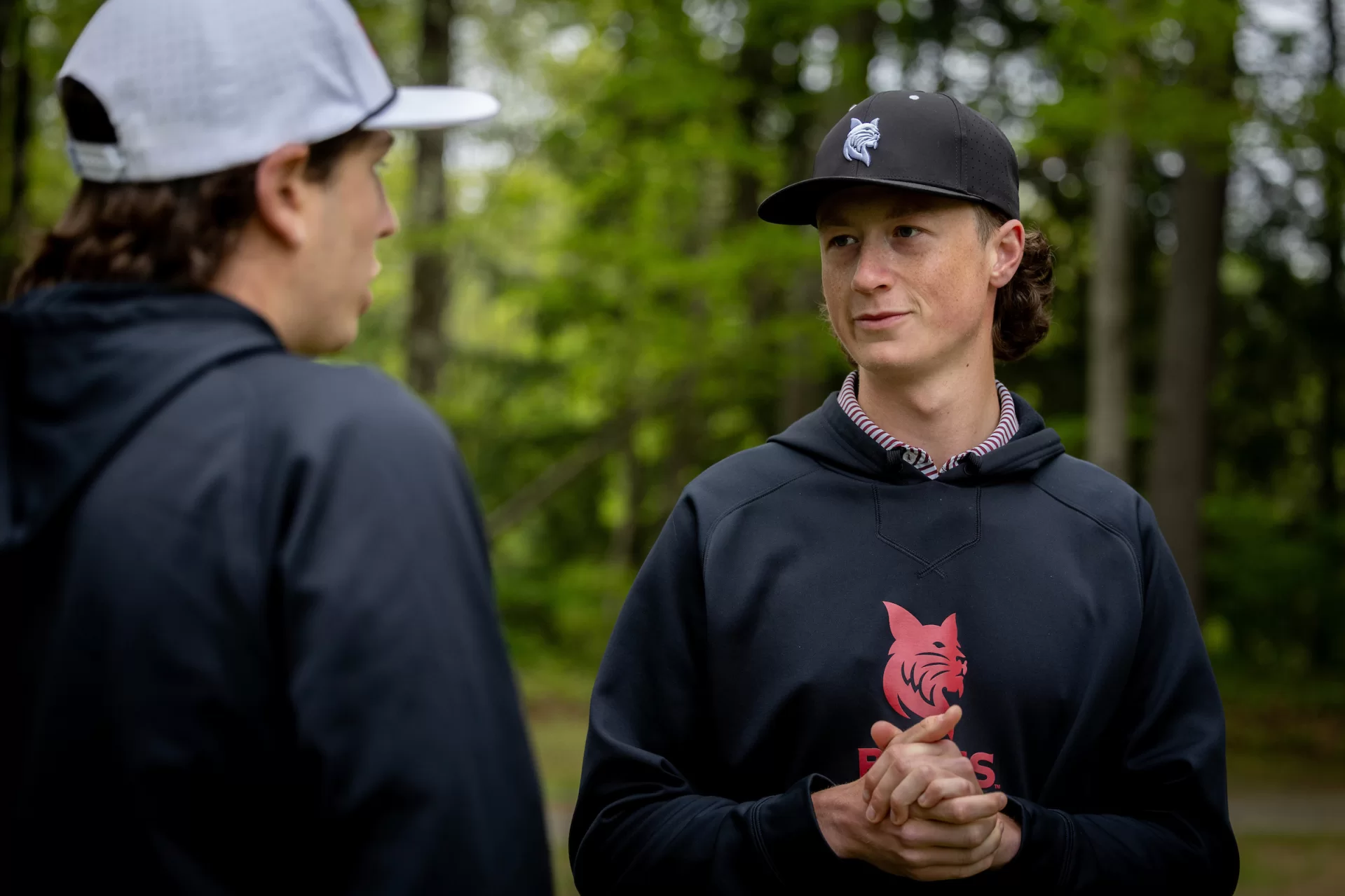At Martindale, Henry Ehrlich ’26 (right) of Portland, Ore., talks with teammate Charlie Weinman ’27 of Rye, N.Y. “When you're on the course as a golfer, it's so easy to get in your own head,” Ehrlich said. “Thinking about the way the course is constructed and how everything's laid out isn’t something that's always at the top of your mind.” (Phyllis Graber Jensen/Bates College)