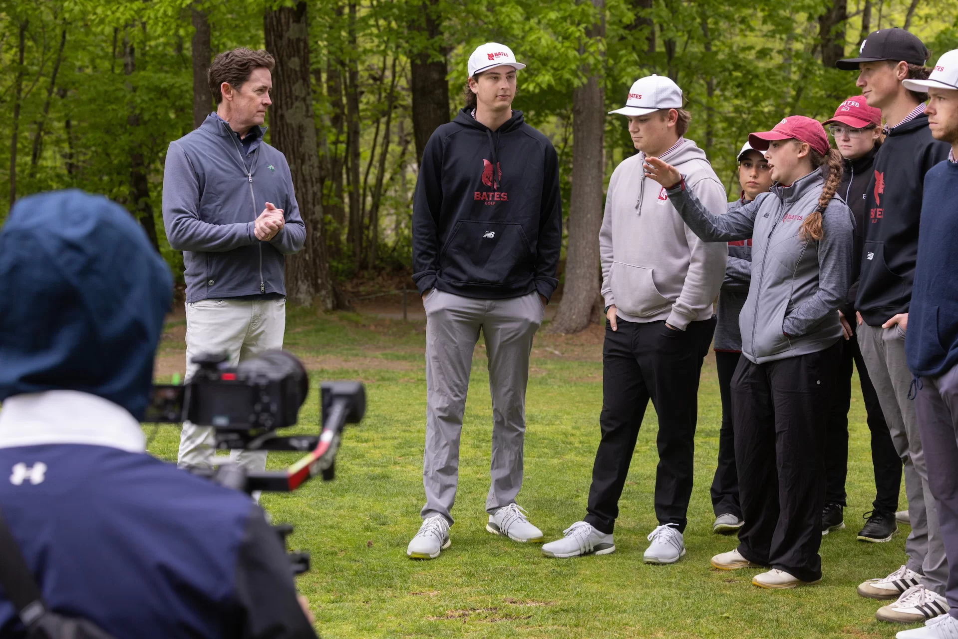 At Martindale, Isabelle Meltzer ’28 of Summit, N.J., explains to Duncan the challenges of the tee shot from the par-4 13th hole agrees. “A big part of scoring in golf is being good at course management," she said. "Walking the course gave me more things to think about when it comes to where I want to be on a green or fairway in a competition.” (Phyllis Graber Jensen/Bates College)