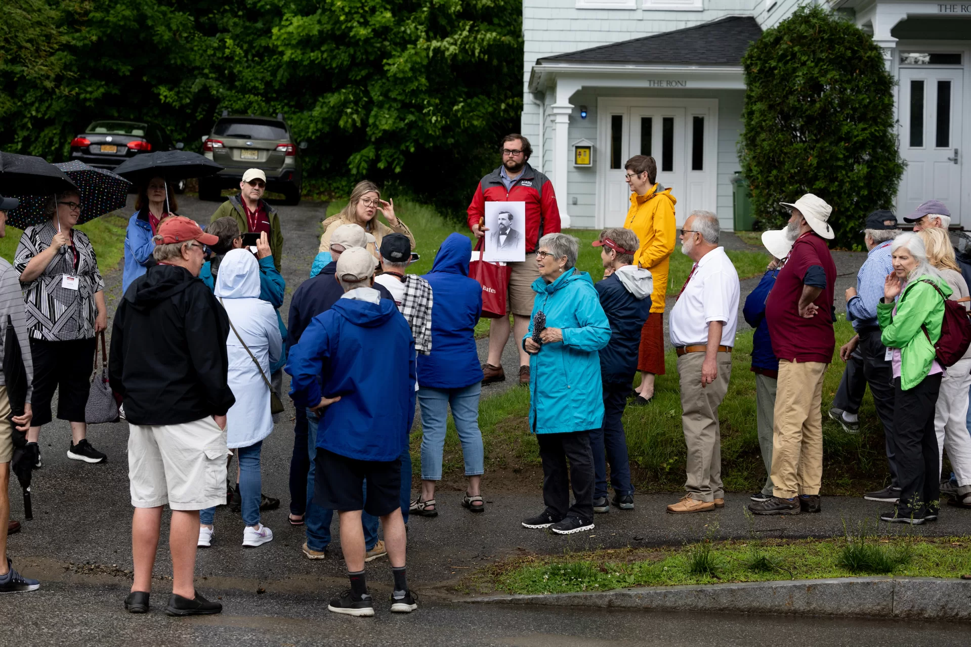 During the 2024 reunion, Muskie Archives staff lead a tour of Frye Street. Caitlin Lampman, the education and engagement archivist, is shown at the left, talking to the group, and to the right, Sam Howes, reference and digital initiatives archivist, displays archival material. (Phyllis Graber Jensen) 