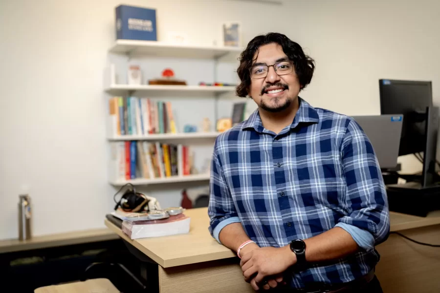 Misa Beltran-Guzman, director of first-generation programs, in his office at the Student Center for Belonging and Community. (Phyllis Graber Jensen/Bates College)