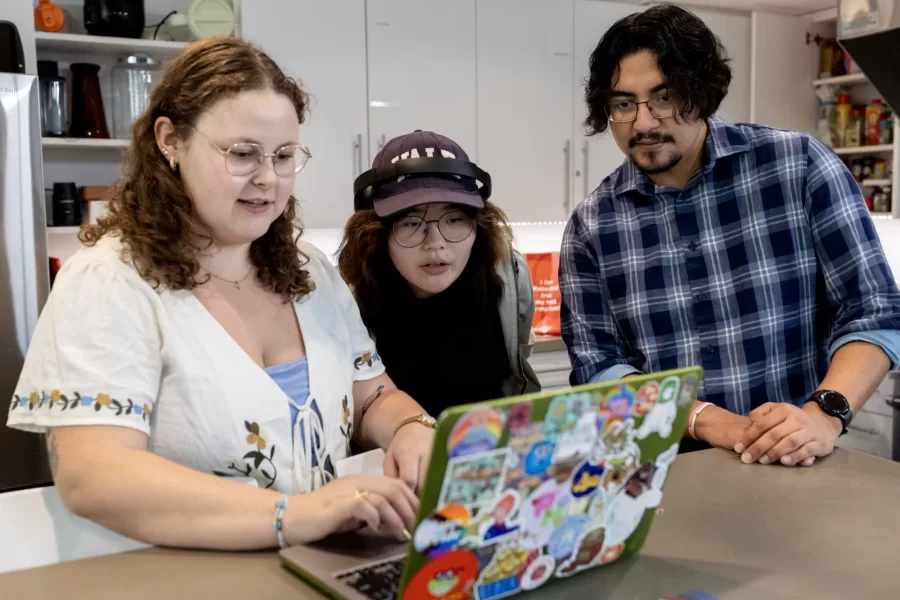 Misa Beltran-Guzman in the kitchen of the Student Center for Belonging and Community with Sadie New, admission counselor (left) and Alina Kunakbayeva ’27 of Kazakhstan. (Phyllis Graber Jensen/Bates College)