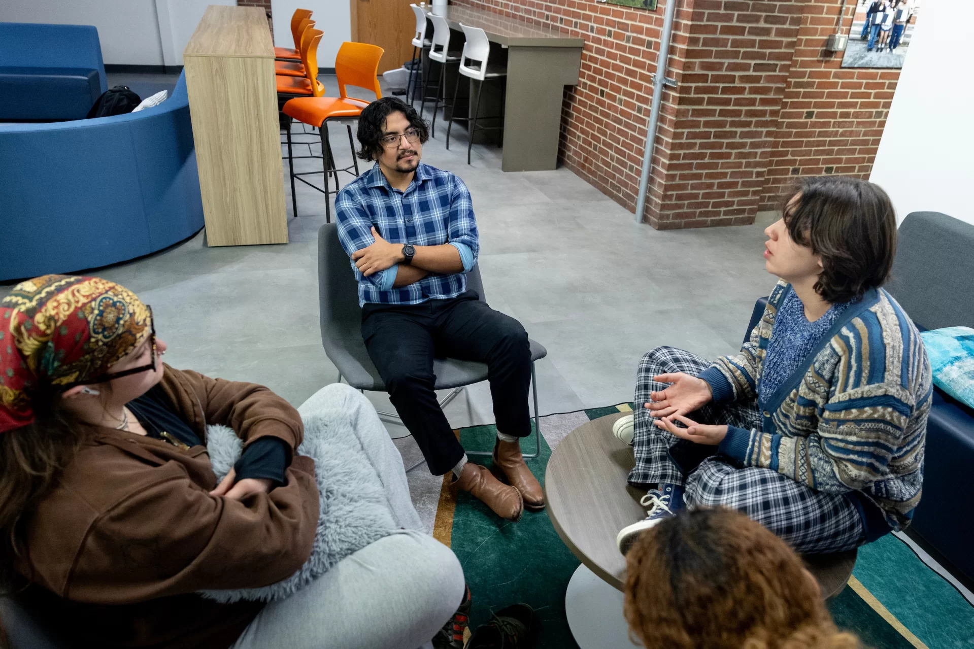Misa Beltran-Guzman
mbeltranguzman@bates.edu
Director of First-Generation Programs
Student Center for Belonging and Community
Misa poses for portraits in his SCBC office and entry, and then interacts with colleagues and students. The session between 4-6 p.m. on Mondays is called “Snack and Chat.”
Cooking in kitchen s Bianca Vega, Kessler Scholars program coordinator
Sadie New, admission counselor (white blouse) Wearing a Bates hat between Sadie and Misa is Alina Kunakbayeva ’27 of Kazakhstan.
Seated with Misa, from left are Alessandra Williams ’29, Kitana James ’29, and Lucy Meeker ’29.