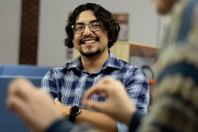 Misa Beltran-Guzman mbeltranguzman@bates.edu Director of First-Generation Programs Student Center for Belonging and Community Misa poses for portraits in his SCBC office and entry, and then interacts with colleagues and students. The session between 4-6 p.m. on Mondays is called “Snack and Chat.” Cooking in kitchen s Bianca Vega, Kessler Scholars program coordinator Sadie New, admission counselor (white blouse) Wearing a Bates hat between Sadie and Misa is Alina Kunakbayeva ’27 of Kazakhstan. Seated with Misa, from left are Alessandra Williams ’29, Kitana James ’29, and Lucy Meeker ’29.
